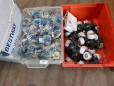 *Two Boxes Containing Novelty Keyrings and Skateboard Wheels