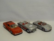 Three 1:18 Scale Collectible Cars. a Chevrolet, a Porsche and a Ferrari