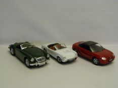 Three 1:18 Scale Collectible Cars. Two MGs and One Triumph