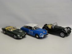 Three Burago 1:18 Scale Collectible Cars. Two Jaguars and One Citroen