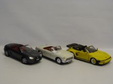 Three Burago 1:18 Scale Collectible Cars. Two MGs and One Porche