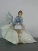 Large Nao Figurine and a Seated Girl