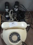 Two BT Synergy Telephones and a White Telephone