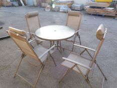 Circular Patio Table with Four Folding Chairs