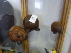 Three Carved Wood Hedgehogs