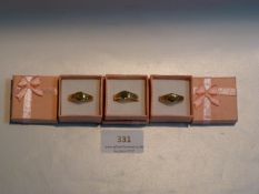 THREE GOLD METAL SIGNET RINGS