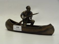 NATIVE AMERICAN FIGURINE IN CANOE