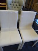 TWO WHITE LEATHER DINING CHAIRS