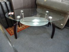 Oval Glass Coffee Table in Chrome + Black Finish