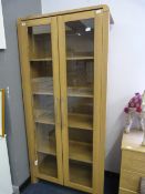 LIGHT OAK DOUBLE DOOR GLAZED BOOKSHELF