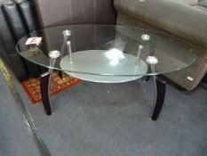 Oval Glass Coffee Table in Chrome + Black Finish