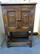 SMALL OAK TWO DOOR CABINET