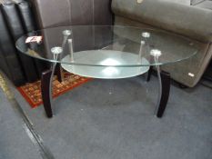 Oval Glass Coffee Table in Chrome + Black Finish