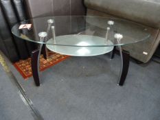 Oval Glass Coffee Table in Chrome + Black Finish