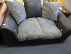 BLACK LEATHER TWO SEAT SETTEE WITH GREY CUSHIONS