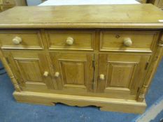 PINE THREE DOOR, THREE DRAWER SIDEBOARD
