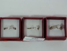 THREE DRESS RINGS SET WITH STONES