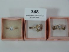 THREE DRESS RINGS SET WITH STONES