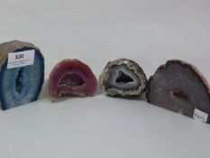 FOUR POLISHED CRYSTAL STONES