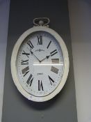 LARGE OVAL METAL FRAMED CLOCK