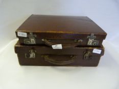 One Leather and One Cardboard Attache Cases