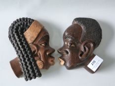 Two Carved Wood African Heads