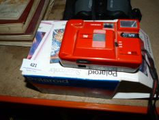 Polaroid Camera and one Other