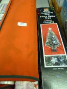 Assorted Wrapping Paper and an Artificial Christmas Tree