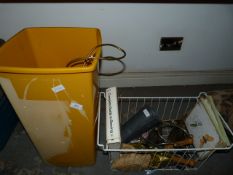 Basket Containing Irons, Golf Balls and a Brass Table Lamp