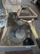 Tennis Racket and a Box of Glassware