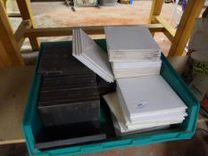 Box of Black Floor Tiles and White Wall Tiles