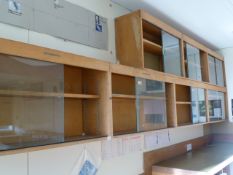 *Seven Wood Storage Cabinets Enclosed by Sliding Glass Doors