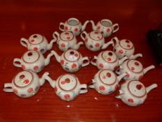 *Twelve Oriental Patterned Teapots with Lids and Two Others