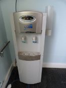 *Water Cooler and a Light Oak Side Table