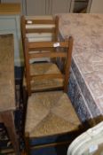 Pair of Raffia Seated Oak Framed Dining Chairs