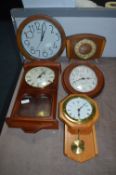 Four Wall Clocks and One Mantel Clock