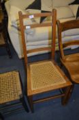 Oak Cane Seated Chair and a Kitchen Chair