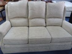 Oatmeal Upholstered Three Seat Settee