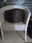 Wicker Armchair and a Leather Pouffe