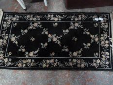 Small Black Patterned Rug