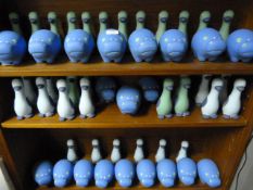 Three Shelves of Ceramic Hippos and Ducks