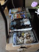 Box Containing Various DVDs and CDs