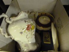 Box Containing a Large Water Jug and Dinnerware