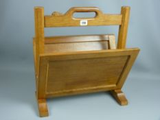 A rare Robert 'Mouseman' Thompson magazine rack with signature mouse to the handle, 47 cms high,