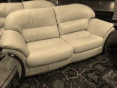A modern quality cream leather two seater settee, 212 cms wide