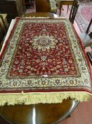 A red ground Kashmir rug with Sharbas design, approximately 6 x 4 ft