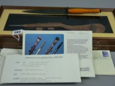 A commemorative F-S commando fighting knife with leather scabbard in mahogany effect display case, a