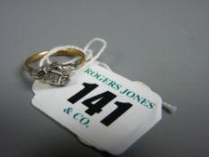 An eighteen carat gold and platinum diamond set crossover engagement ring, the central stone 0.03