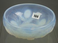 A Jobling opalique style relief moulded bowl with harvest grasses type pattern, 18 cms diameter