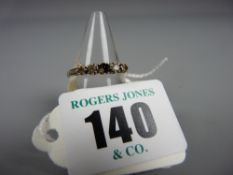 A nine carat gold engagement ring with five stone setting, two 0.03 carat, two 0.05 carat, central